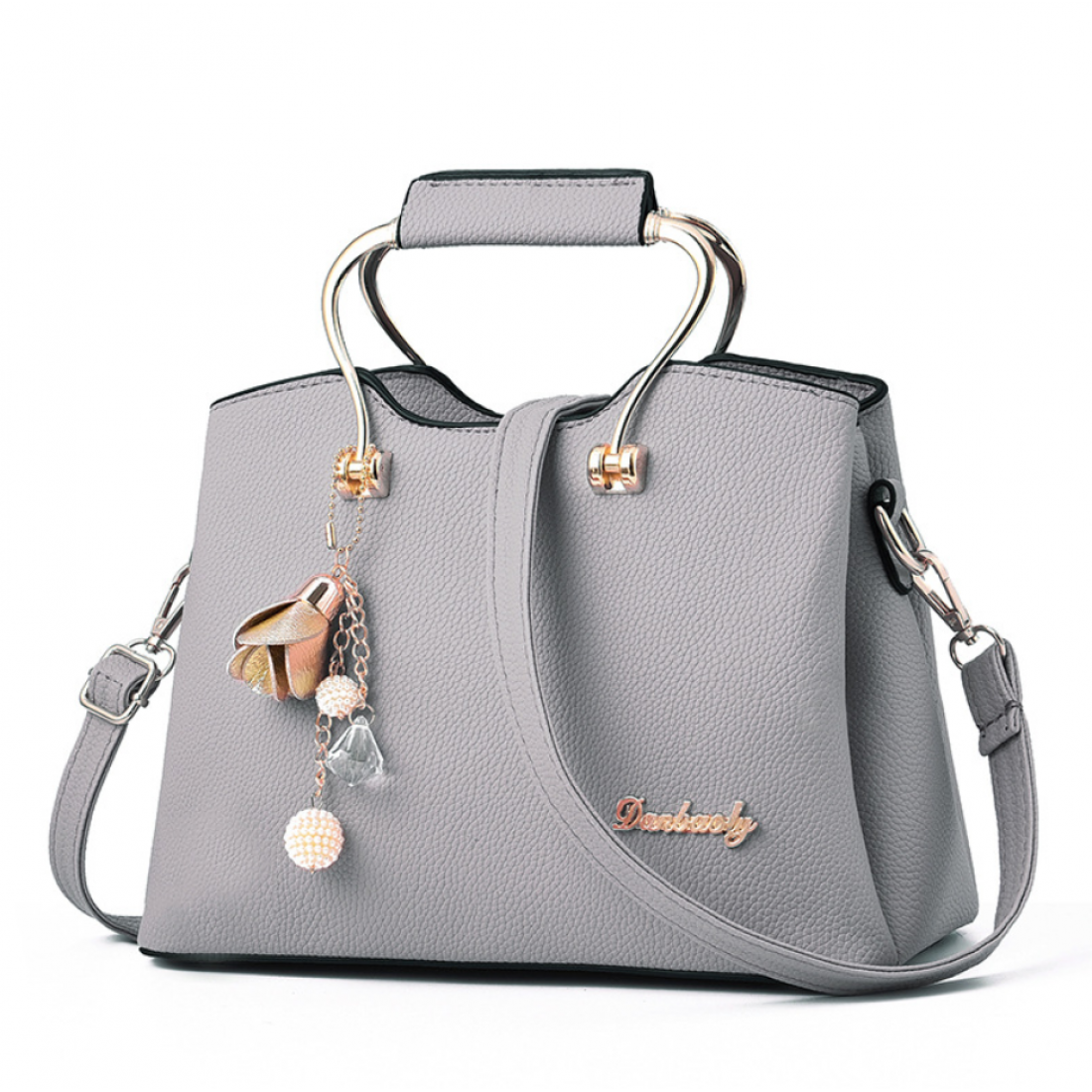 Elegant Handbag with Gold Handles and Charm Pendant